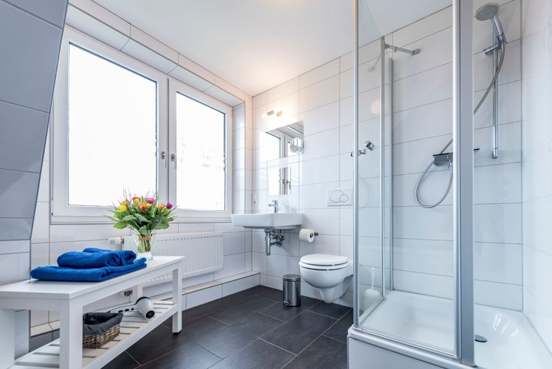Bathroom with shower cubicle and large window