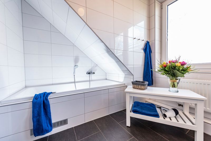 Bathroom with whirlpool tub under the sloping roof