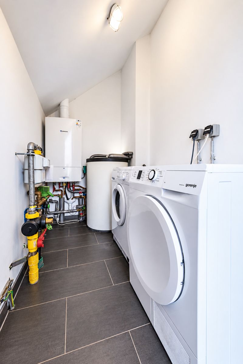 Utility room with washer and dryer