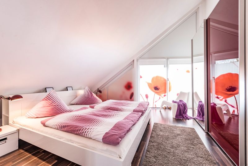 Bedroom with double bed under the sloping roof